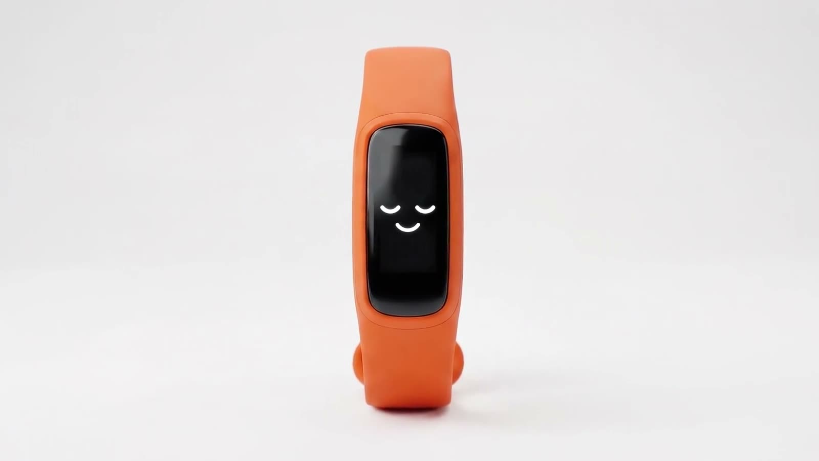 A rendered orange fitness band standing upright in a white studio, a sleeping face with closed eyes on its display.